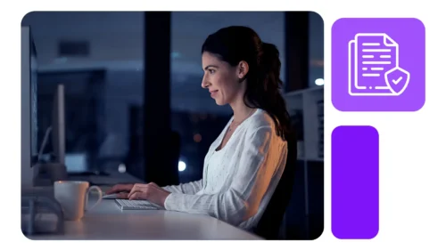 Mulher de perfil, trabalhando à noite em um escritório iluminado, concentrada em computador; ícone roxo de documento validado aparece ao lado.
